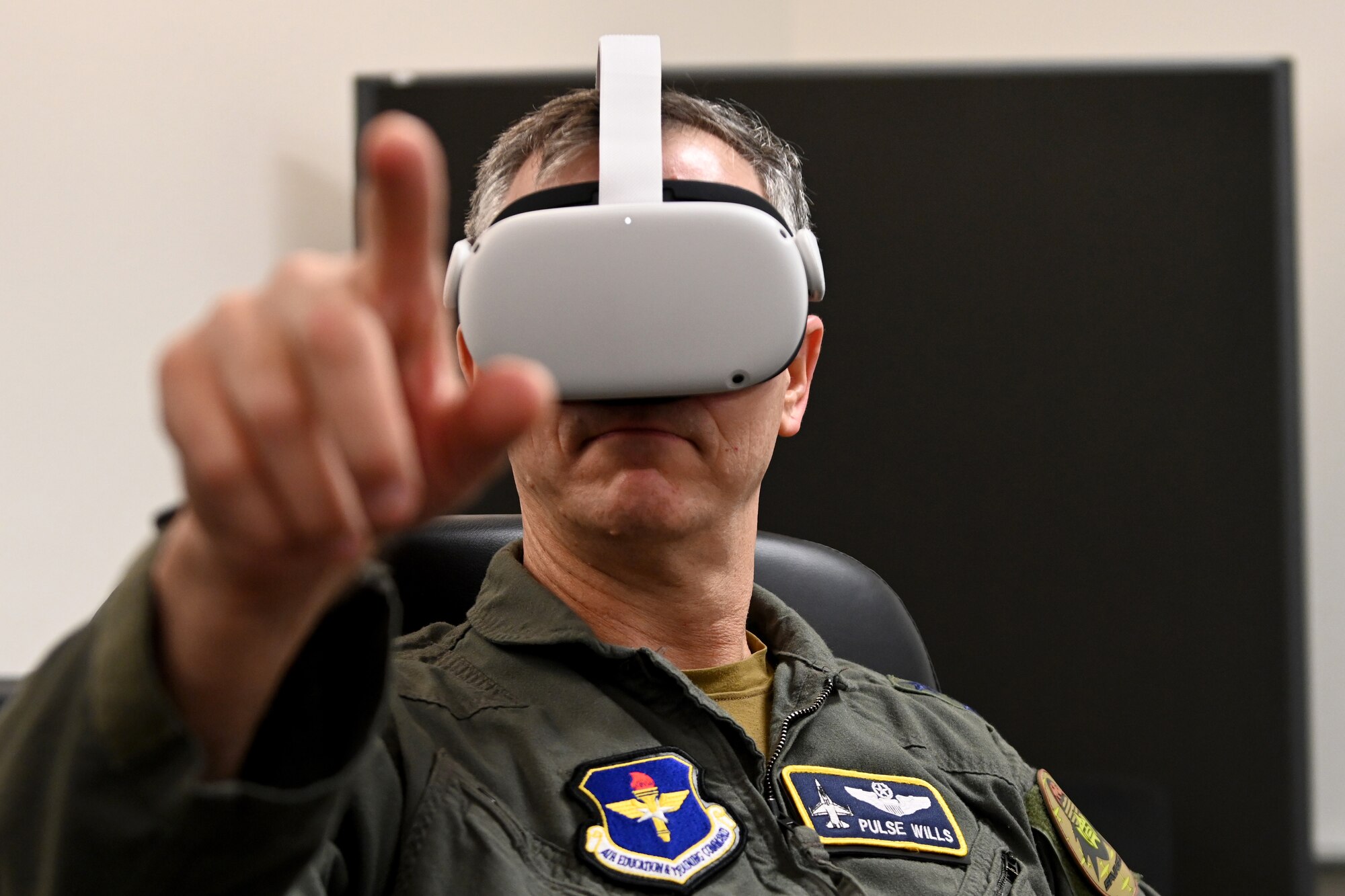 Maj. Gen. Craig D. Wills, 19th Air Force commander, views a virtual reality MQ-9 training program, July 20, 2021, on Holloman Air Force Base, N.M. The 16th Training Squadron uses MQ-9 Reaper simulators to train pilots and sensor operators for their field. (U.S. Air Force photo by Staff Sgt. Christopher S. Sparks)