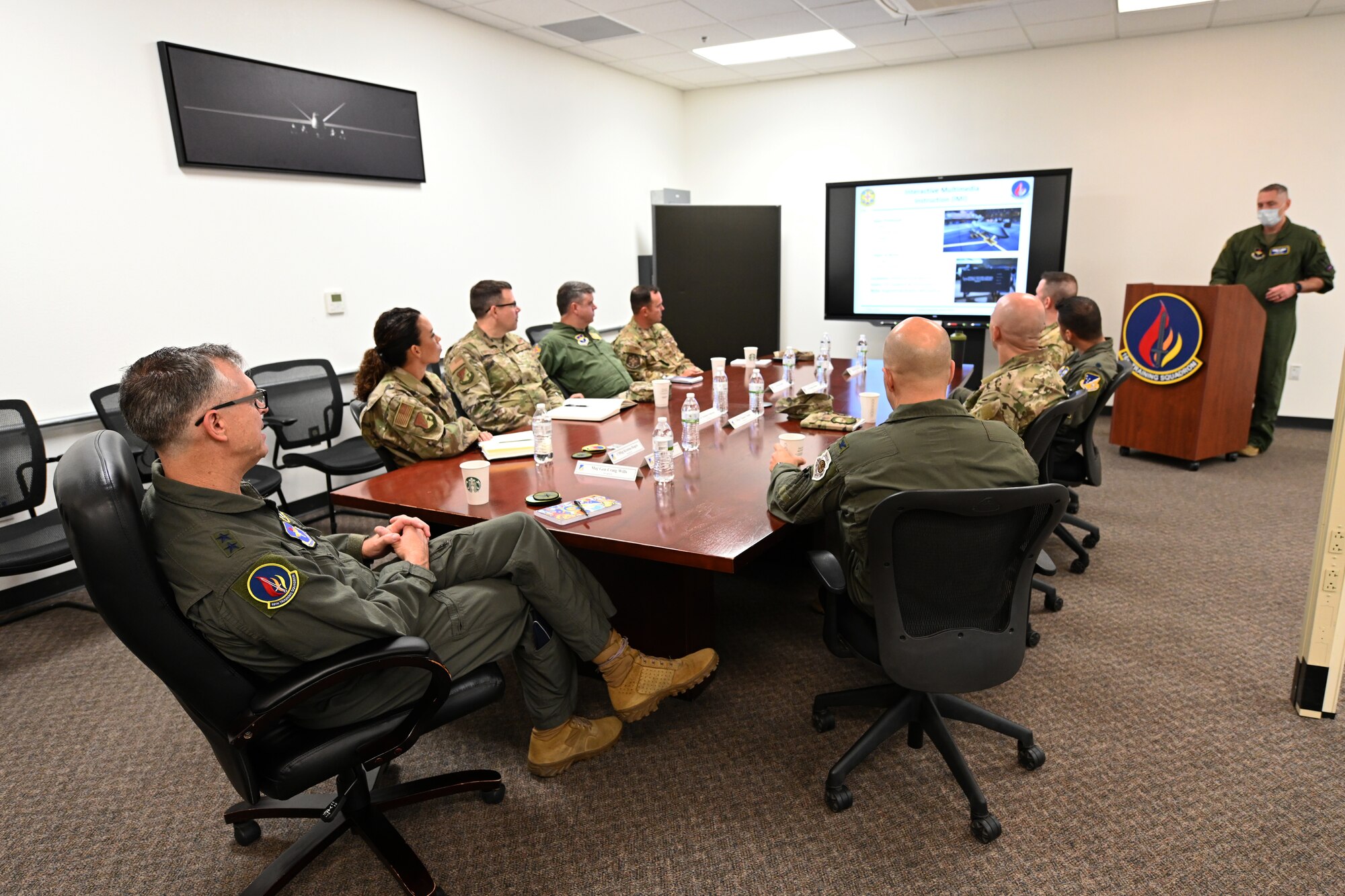 Maj. Gen. Craig D. Wills, 19th Air Force commander, listens to a 16th Training Squadron mission brief July 20, 2021, on Holloman Air Force Base, N.M. The command team held three all calls and discussed the future of the MQ-9 Reaper enterprise. (U.S. Air Force photo by Staff Sgt. Christopher S. Sparks)