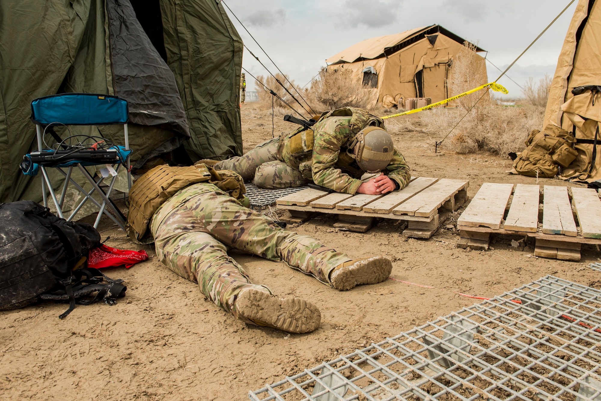 27th Special Operations Mission Support Team members take cover during a 27th Special Operations Wing operational readiness exercise at Dugway Proving Grounds, Utah, March 22, 2021. The Mission Support Team concept provides a way forward in building small, scattered teams capable of operating independent of main operating bases. (U.S. Air Force photo by Senior Airman Vernon R. Walter III)