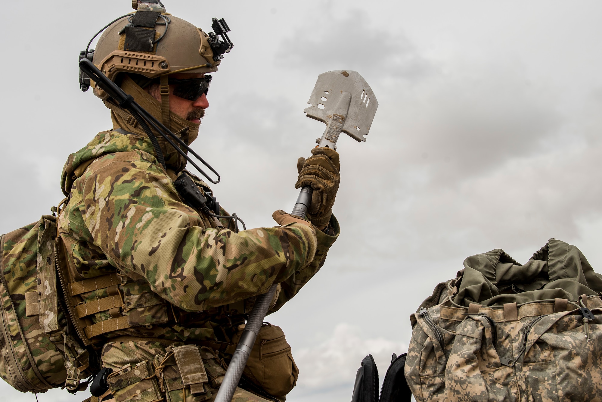 An Explosive Ordinance Disposal Airman assigned to the 27th Special Operations Mission Support Team prepares a shovel during a 27th Special Operations Wing operational readiness exercise at Dugway Proving Grounds, Utah, March 22, 2021. The Mission Support Team concept provides a way forward in building small, scattered teams capable of operating independent of main operating bases. (U.S. Air Force photo by Senior Airman Vernon R. Walter III)