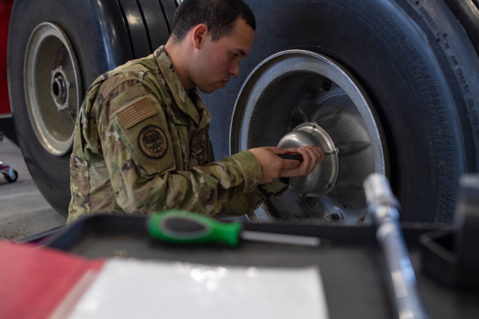 Airman 1st Class Eddy Lopez of Jersey City, New Jersey, goes through the steps of removing a tire and wheel from a landing gear assembly trainer at Sheppard Air Force Base, Texas, March 3, 2020. Lopez and his fellow 362nd Training Squadron heavy crew chief students learned the steps via virtual reality and then transfered their technology instruction to hands-on practice. The initiative is part of Maintenance Next, which is new method of employing technology to train today's aircraft maintainers. (U.S. Air Force photo by John Ingle)