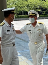 Chief of Naval Operations (CNO) Adm. Mike Gilday greets Chief of the Maritime Staff Adm. Hiroshi Yamamura .