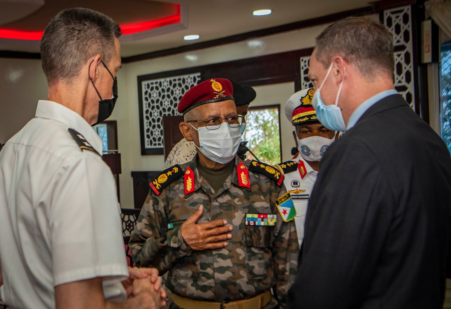 (July 25, 2021) Gen. William Zana, Combined Joint Task Force-Horn of Africa commanding general, left, and John Pratt, U.S. ambassador to Djibouti, right, speaks with Gen. Zakaria Sheikh, commander of Djiboutian Defense Forces, during the exercise Cutlass Express 2021 opening ceremony held at the Doraleh Coast Guard training center, in Djibouti, Djibouti, July 25, 2021. Cutlass Express is designed to improve regional cooperation, maritime domain awareness and information sharing practices to increase capabilities between the U.S., East African and Western Indian Ocean nations to counter illicit maritime activity.