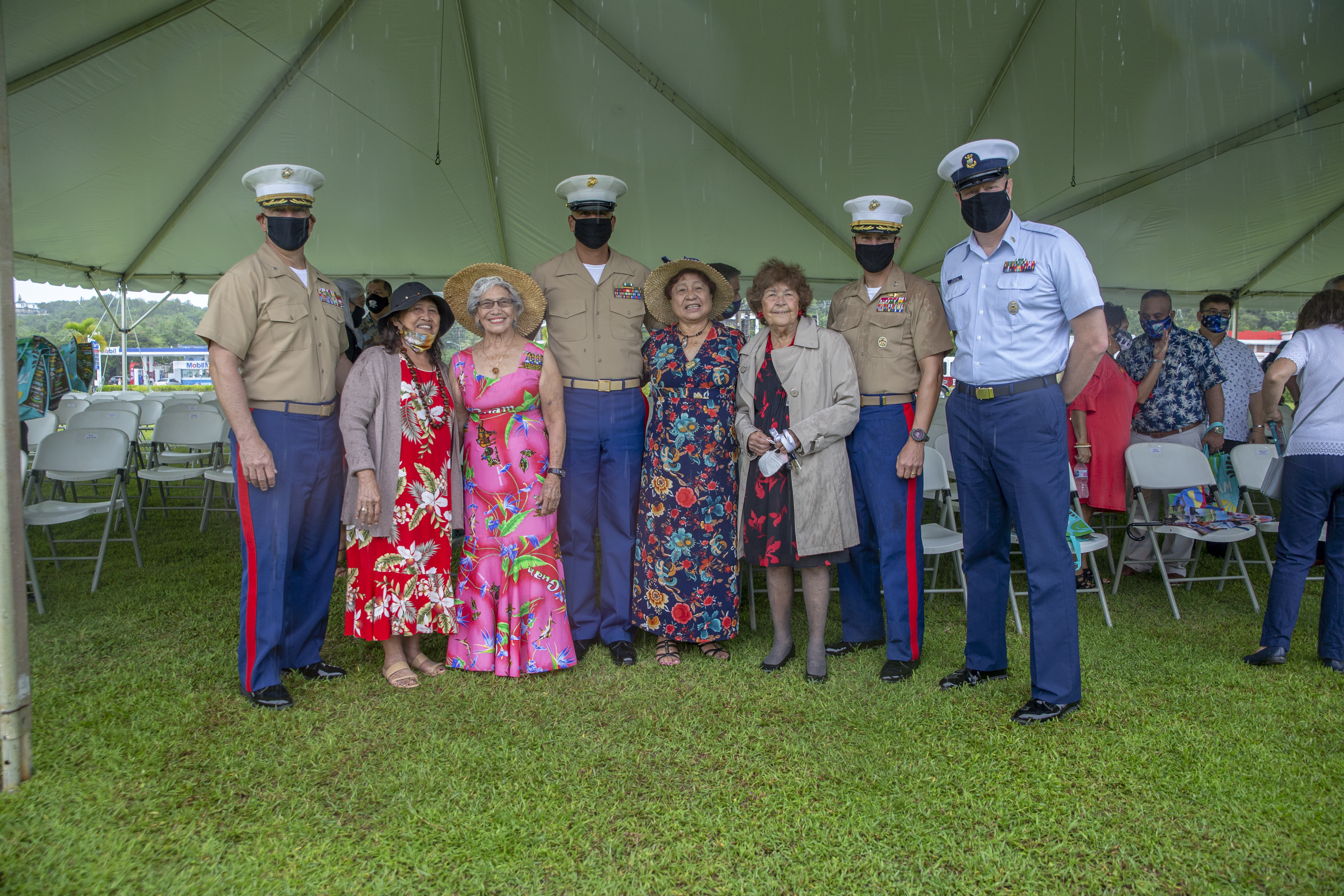 Marine Corps Base Camp Blaz and Coast Guard Sector Guam senior leaders pose for a photograph with World War II survivors during a memorial ceremony at the Ricardo J. Bordallo Governor’s Complex in Adelup, Guam, July 21, 2021.