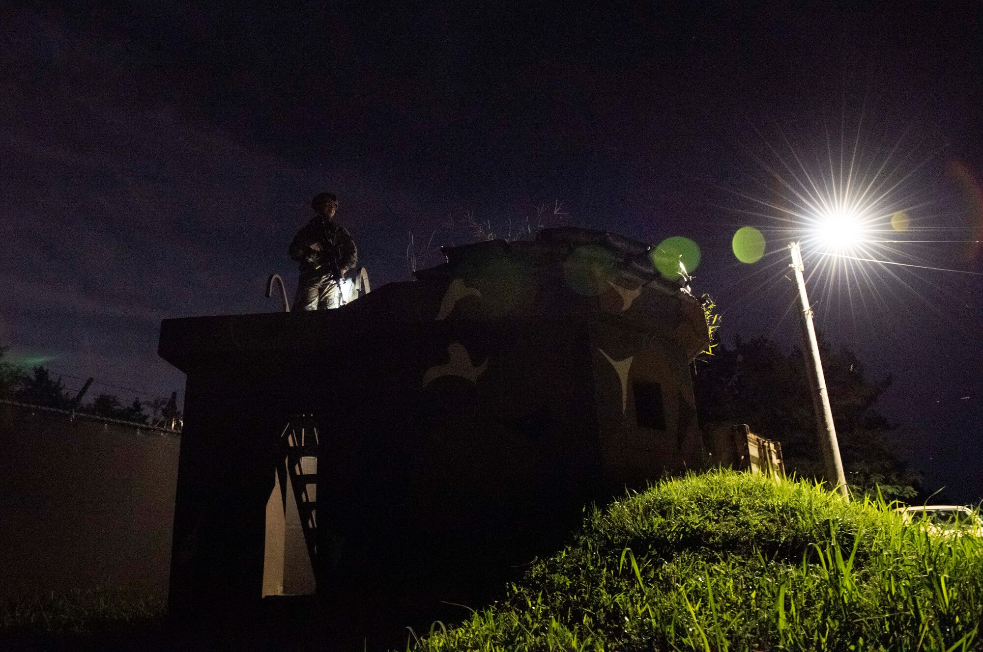 8th Security Forces Squadron Airmen participate in a routine training scenario at Kunsan Air Base, Republic of Korea, July 26, 2021. Members of the 8th SFS broke into teams and cleared buildings on Kunsan AB with the objective of locating and apprehending a criminal role player. These trainings enhance the lethality and readiness of the 8th SFS. (U.S. Air Force photo by Staff Sgt. Gabrielle Spalding)