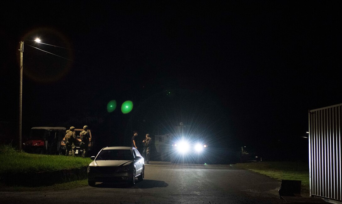 8th Security Forces Squadron Airmen participate in a routine training scenario at Kunsan Air Base, Republic of Korea, July 26, 2021. Members of the 8th SFS broke into teams and cleared buildings on Kunsan AB with the objective of locating and apprehending a criminal role player. These trainings enhance the lethality and readiness of the 8th SFS. (U.S. Air Force photo by Staff Sgt. Gabrielle Spalding)