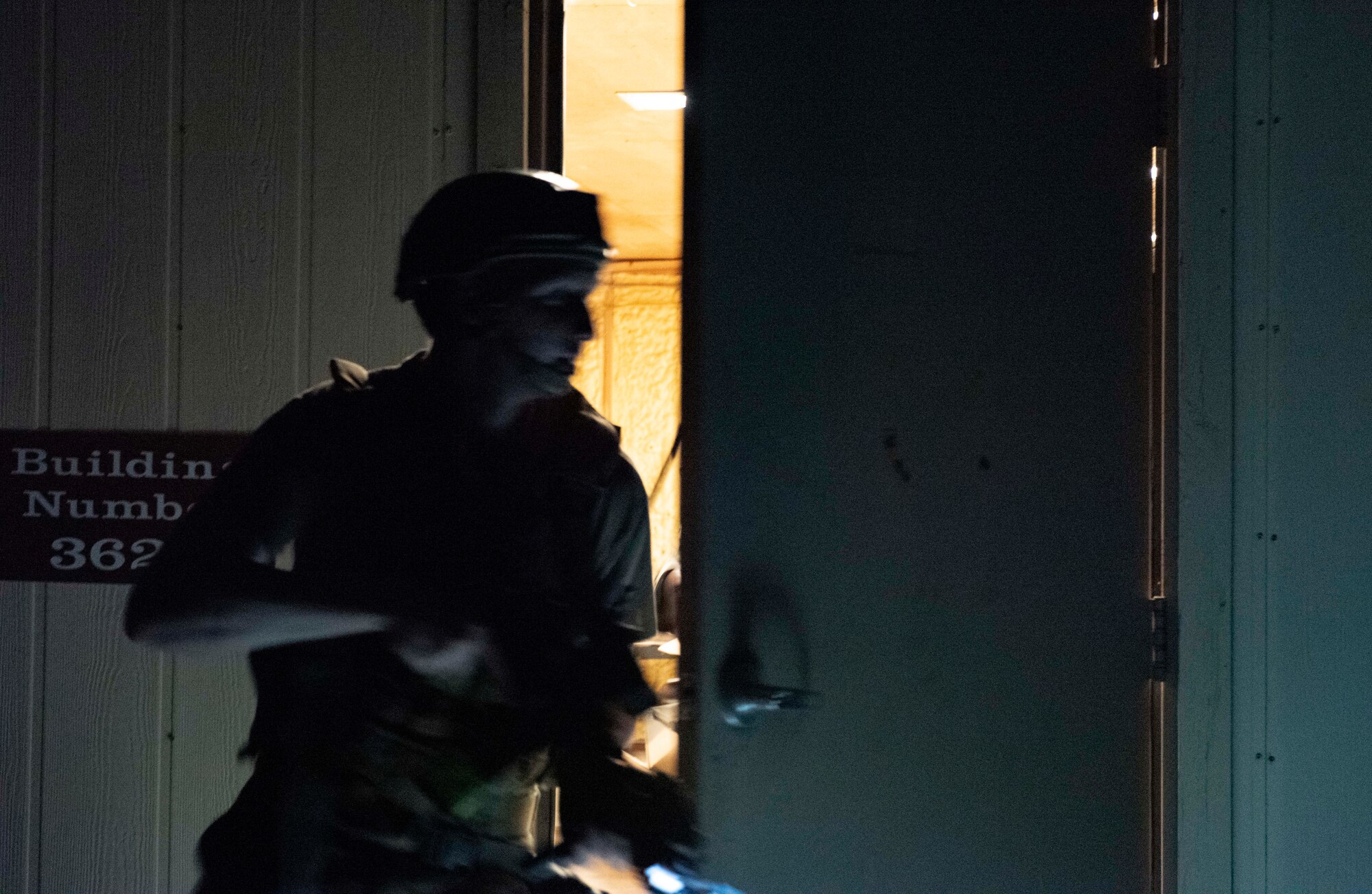 8th Security Forces Squadron Airmen participate in a routine training scenario at Kunsan Air Base, Republic of Korea, July 26, 2021. Members of the 8th SFS broke into teams and cleared buildings on Kunsan AB with the objective of locating and apprehending a criminal role player. These trainings enhance the lethality and readiness of the 8th SFS. (U.S. Air Force photo by Staff Sgt. Gabrielle Spalding)