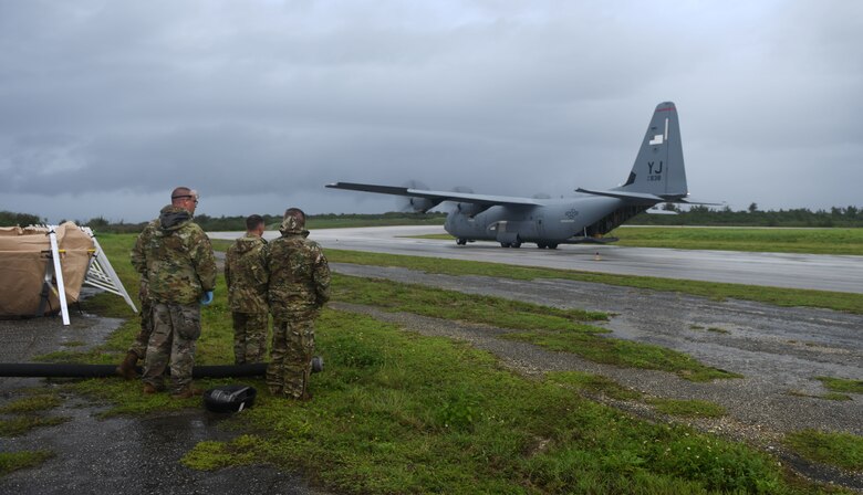 U.S. Air Force Airmen prepare to offload fuel from a C-130J Super Hercules July 21, 2021, at Tinian International Airport, Tinian, during Pacific Iron 2021. Pacific Iron 2021 is a Pacific Air Forces dynamic force employment operation to project forces into United States Indo-Pacific Command's area of responsibility in support of a more lethal, adaptive, and resilient force.