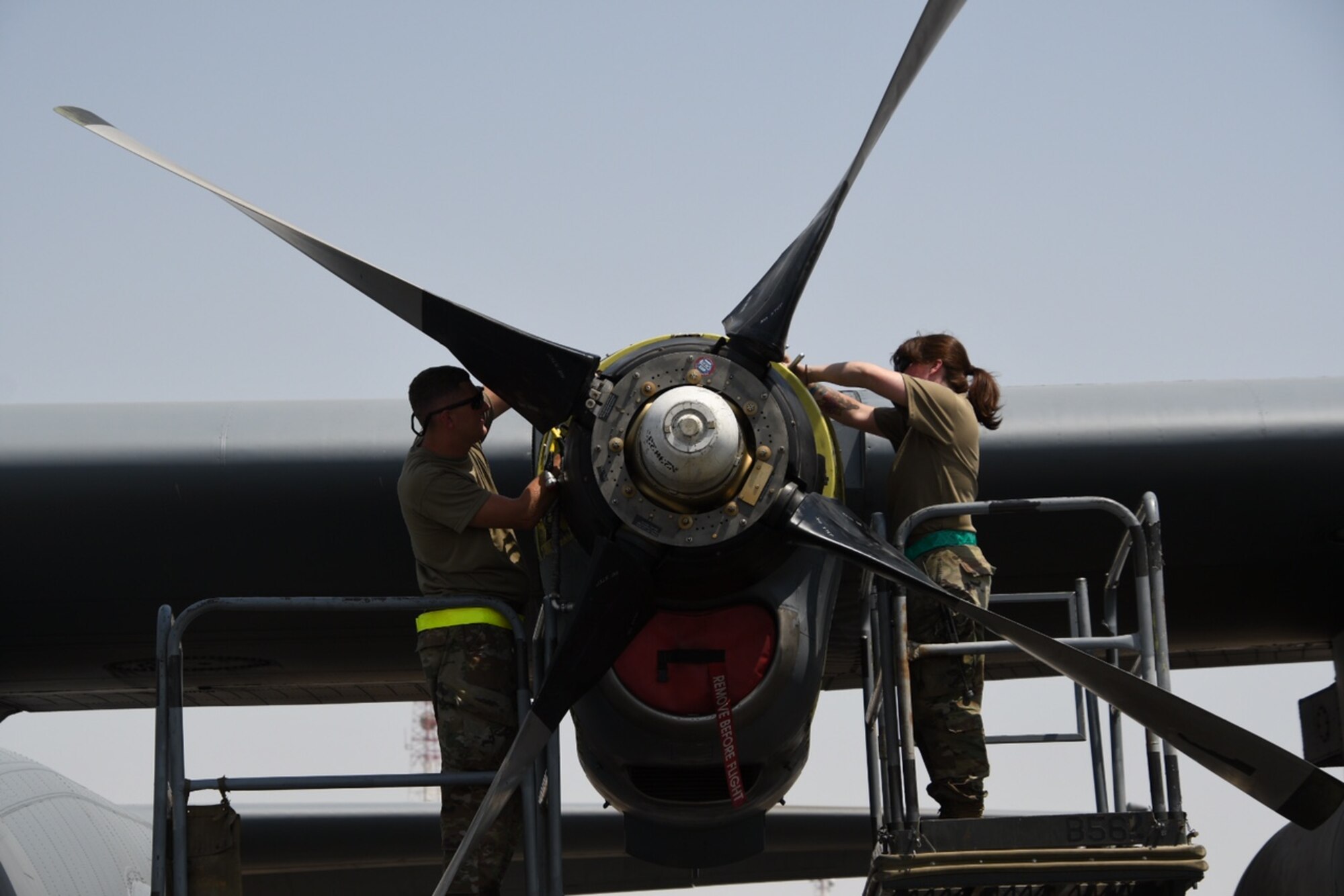 U.S. Air Force Tech. Sgt. Jonathan Hall, a propulsion technician assigned to the 386th Expeditionary Aircraft Maintenance Squadron and deployed from Maxwell Air Force Base, Alabama, and U.S. Air Force Staff Sgt. Cecilia Nguyen, a propulsion technician assigned to the 386th EAMXS and deployed from Maxwell AFB, change a propeller on a C-130 Hercules. The EAMXS works 24-hour operations year-round to keep the C-130 Hercules’ in flight to accomplish the mission of fight to win today and to provide warfighter support in the area of responsibility. (Courtesy Photo)