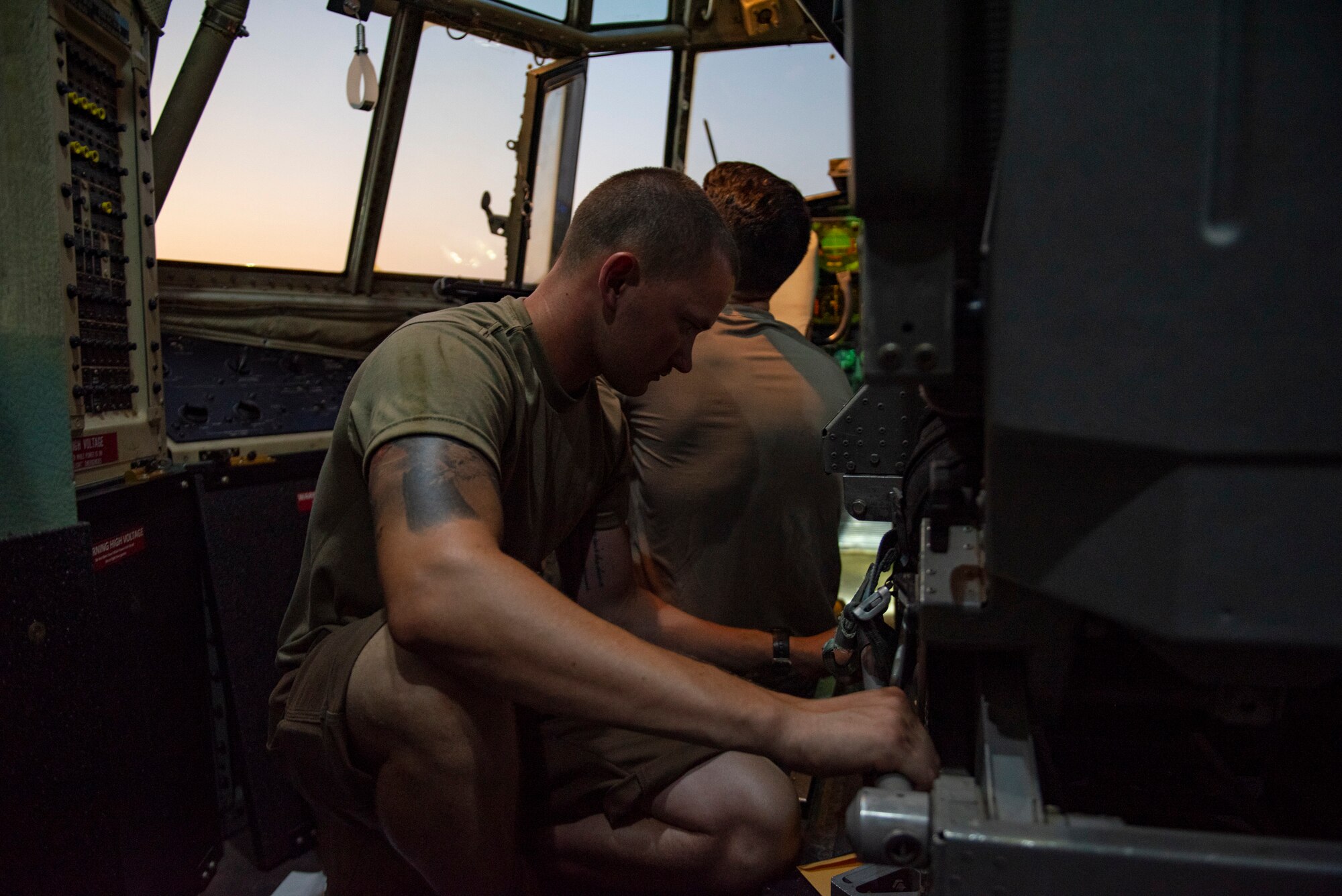 U.S. Air Force Senior Airman Christian Pettus, a crew chief assigned to the 386th Expeditionary Aircraft Maintenance Squadron and deployed from Maxwell Air Force Base, Alabama, removes bolts from a panel on a C-130 Hercules at Ali Al Salem Air Base, Kuwait, July 20, 2021. The EAMXS works 24-hour operations year-round to keep the C-130 Hercules’ in flight to accomplish the mission of fight to win today and to provide warfighter support in the area of responsibility. (U.S. Air Force Photo by Senior Airman Helena Owens)