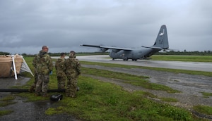 U.S. Air Force Airmen prepare to offload fuel from a C-130J Super Hercules July 21, 2021, at Tinian International Airport, Tinian, during Pacific Iron 2021. Pacific Iron 2021 is a Pacific Air Forces dynamic force employment operation to project forces into United States Indo-Pacific Command’s area of responsibility in support of a more lethal, adaptive, and resilient force.