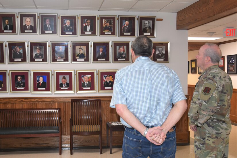 Brig. Gen. Michael Regan, right, Pennsylvania Deputy Adjutant General for Air, shows Richard Posey, the son of Pennsylvania’s first DAG-A, Brig. Gen. Richard Posey, the Department of Military and Veterans Affairs Hall of Fame display at Joint Force Headquarters at Fort Indiantown Gap, Pa.