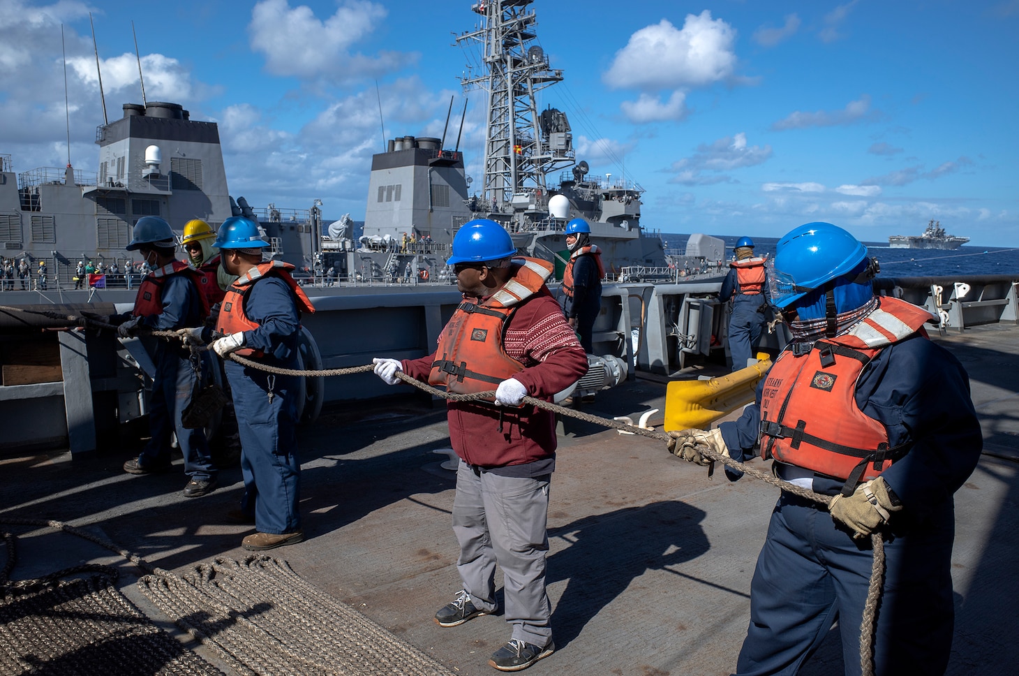 210722-N-N1109-007 CORAL SEA (July 25, 2021) - USNS Rappahannock (T-AO 204) crew members prepare to resupply JS Makinami (DD 112) during Exercise Talisman Sabre 21. This is the ninth iteration of Talisman Sabre, a large-scale, bilateral military exercise between Australia and the United States involving approximately 17,000 participants from seven nations. The month-long, multi-domain exercise consists of a series of training events that reinforce the strong U.S.-Australian alliance and demonstrate the U.S. military’s unwavering commitment to a free and open Indo-Pacific. (Photo by Third Officer Brandon Feinberg)