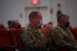 Col. Neil T. Roeder, incoming commander, 3rd Medical Command Forward "Desert Medics," claps during a transfer of authority ceremony at Camp Arifjan, Kuwait, July 16, 2021. Roeder will lead the Detachment 10 unit here in theater.