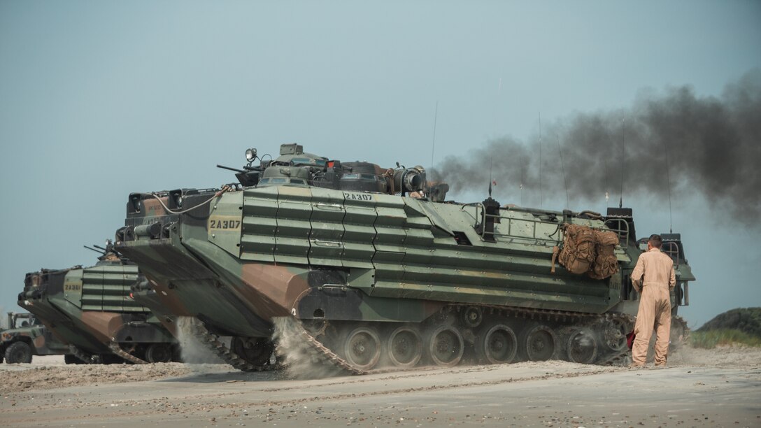 U.S. Marines with 2d Assault Amphibian Battalion (AABn.), 2d Marine Division, prepare to splash during a mechanized amphibious egress exercise on Camp Lejeune, N.C., July 22, 2021.  This training strengthened the unit’s capacity to conduct amphibious training in the Atlantic while ensuring safety of operations. (U.S. Marine Corps photo by Cpl. Patrick King)