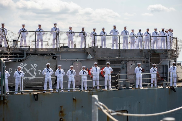 Sailors man the rails aboard USS Vella Gulf (CG 72), as the ship returns to its homeport of Norfolk, Virginia, following a scheduled deployment to the 6th and 5th fleet areas of operations.