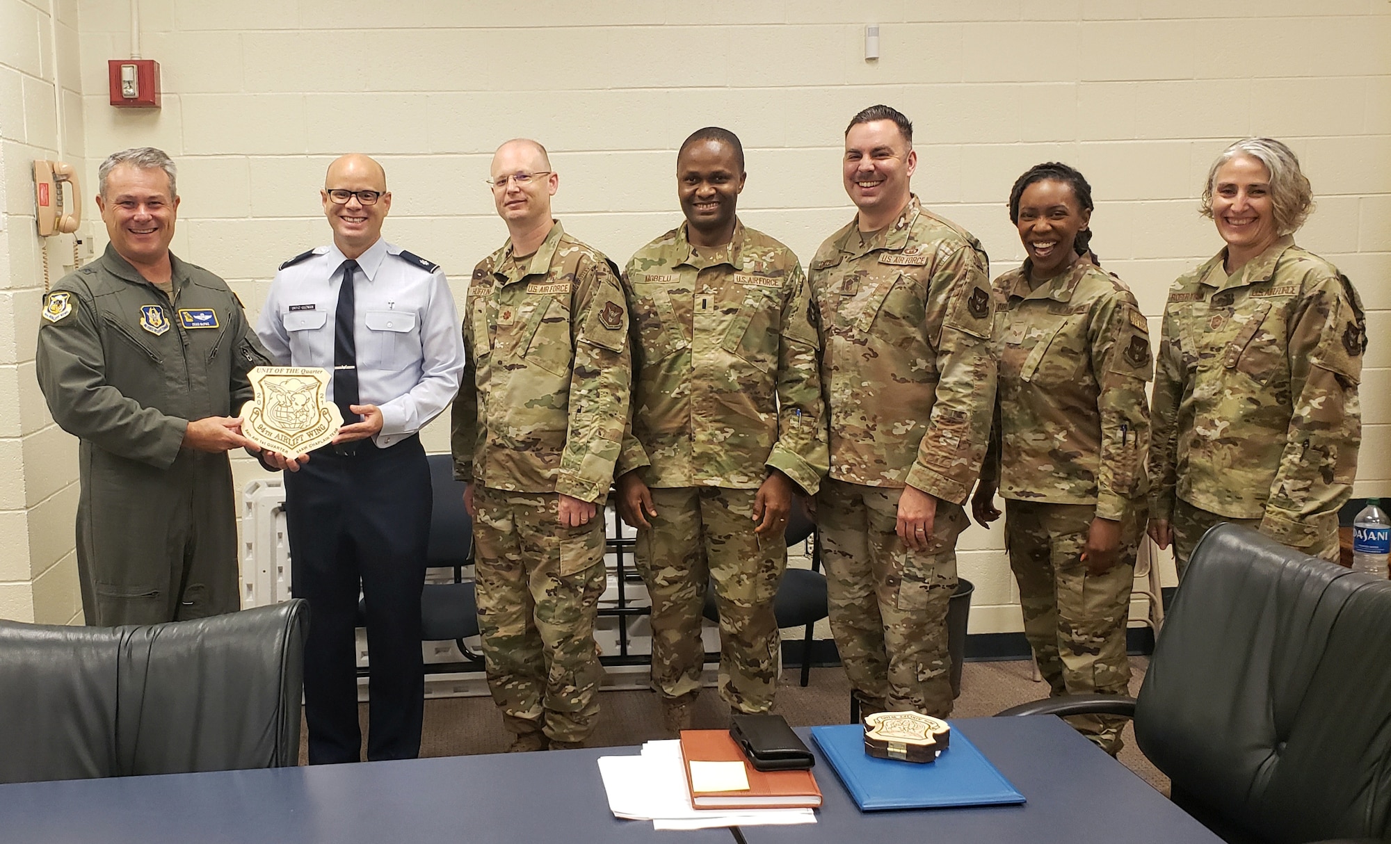 94th Airlift Wing Chaplain's office is presented with their engraved award for winning "Team of the Quarter" for first quarter 2021.
