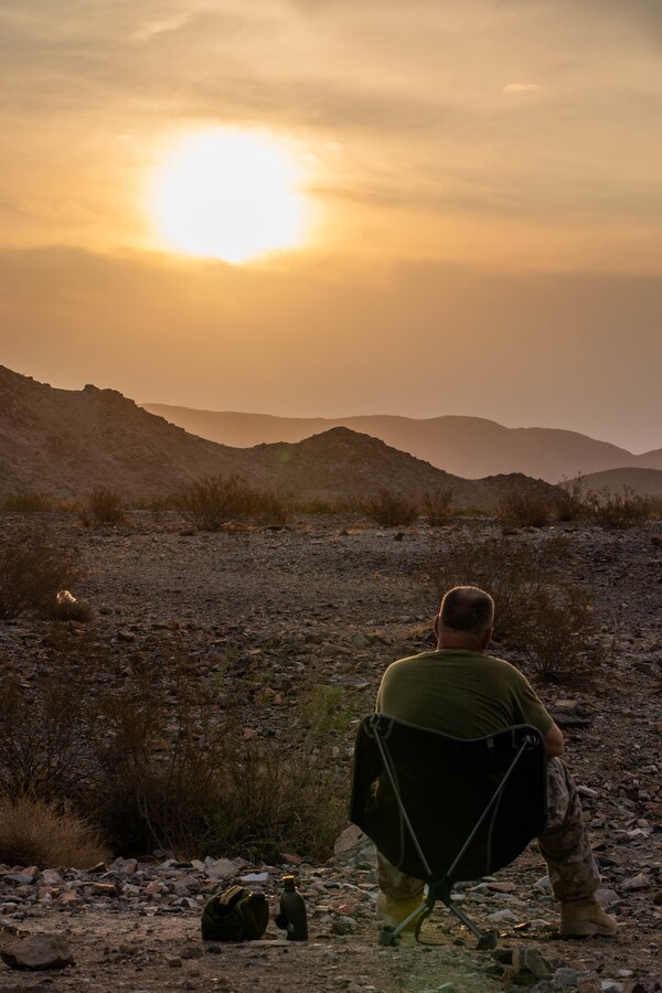 A Marine with 3rd Battalion, 25th Marines, 4th Marine Division, eats chow prior to executing Range 400 during Integrated Training Exercise (ITX) 4-21 at Marine Corps Air Ground Combat Center Twentynine Palms, California on July 23, 2021. ITX is the culmination of Marine Forces Reserve units’ training cycle as they participate in a live-fire, combined arms exercise as a part of an integrated Marine Air Ground Task Force. (U.S. Marine Corps photo by Lance Cpl. David Intriago)