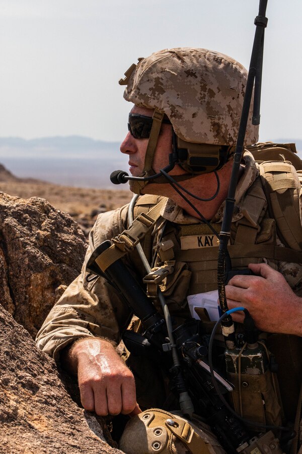 A Marine with 3rd Battalion, 25th Marines, 4th Marine Division, calls for fire at Range 400 during Integrated Training Exercise (ITX) 4-21 at Marine Corps Air Ground Combat Center Twentynine Palms, California on July 23, 2021. ITX is the culmination of Marine Forces Reserve units’ training cycle as they participate in a live-fire, combined arms exercise as a part of an integrated Marine Air Ground Task Force. (U.S. Marine Corps photo by Lance Cpl. David Intriago)
