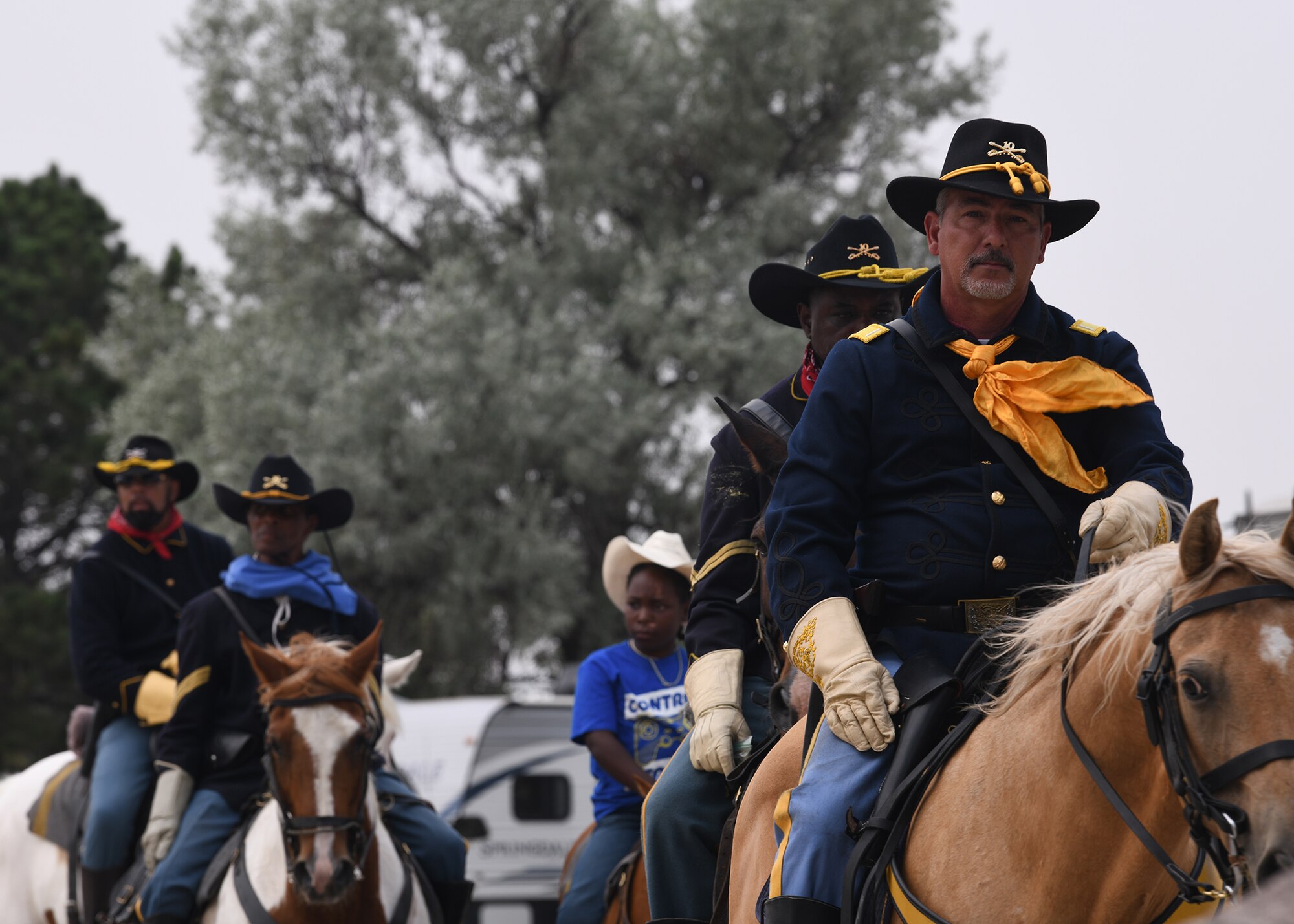 Volunteer reenactors ride off to dismount their horses after performing a reenactment July 24, 2021, during Fort D.A. Russell Days on F.E. Warren Air Force, Wyoming. Fort D.A. Russell Days is a time for F.E. Warren Air Force Base to share its history and heritage with the community. ( U.S. Air Force photo by Airman 1st Class Darius Frazier.)