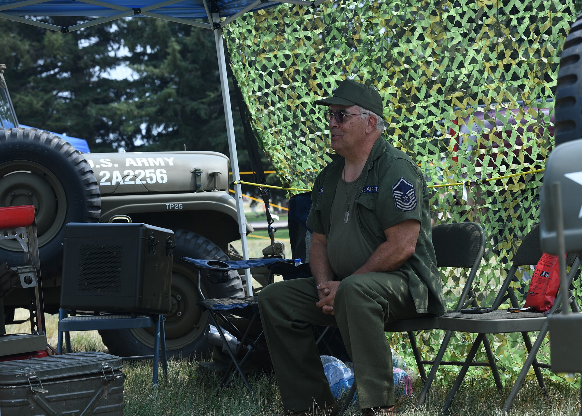 Frank Disney shares his knowledge of U.S. Army equipment with people visiting July 24, 2021, during Fort D.A. Russell Days on F.E. Warren Air Force, Wyoming, . Fort D.A. Russell Days is a time for F.E. Warren Air Force Base to share its history and heritage with the community. (U.S. Air Force photo by Airman 1st Class Darius Frazier)