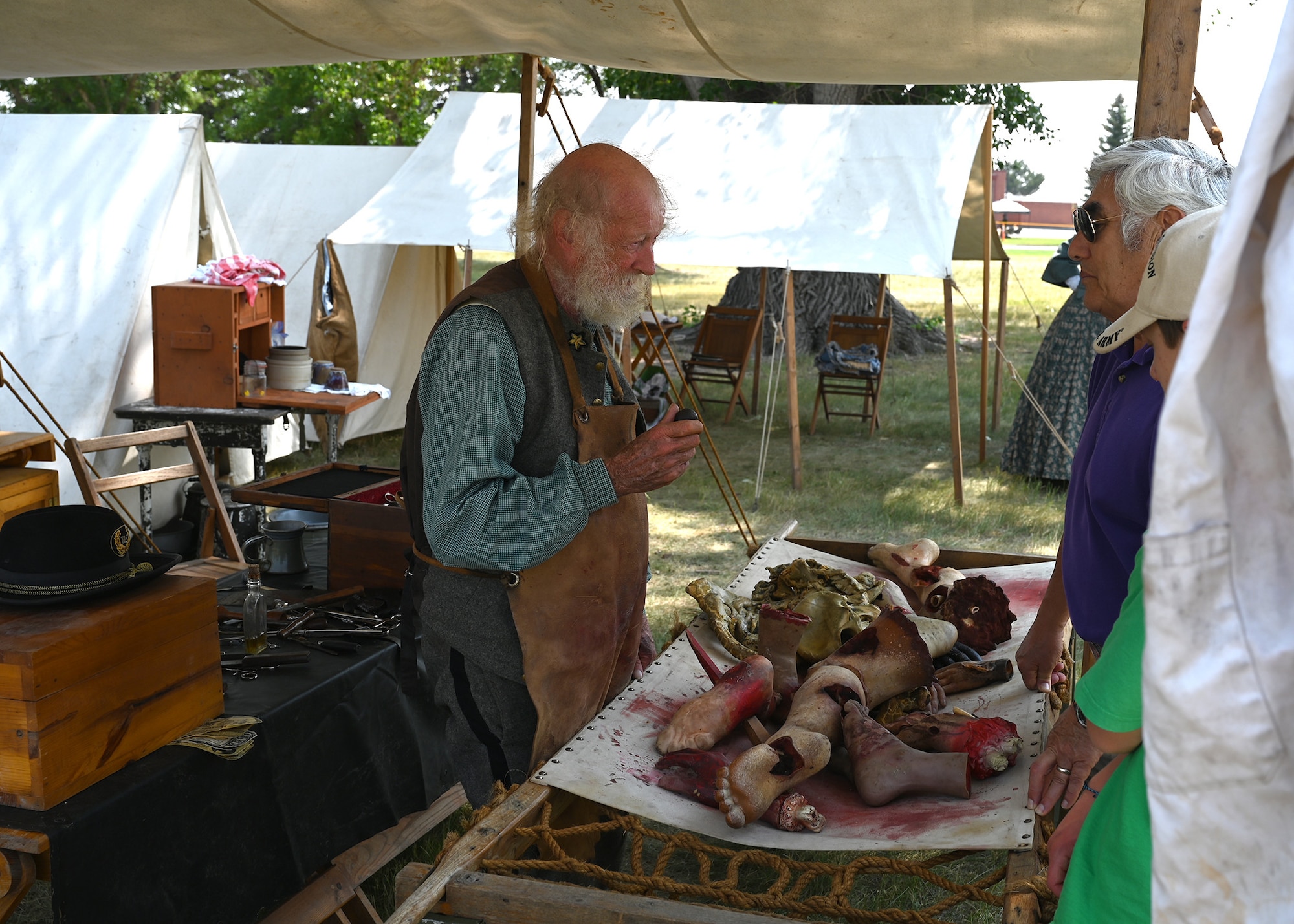 Doug Helgeson explains the brutality of a Civil War-era field hospital to visitors to Fort D.A. Russell Days July 25, 2021 on F.E. Warren Air Force Base, Wyoming. Fort D.A. Russell Days is a time for F.E. Warren Air Force Base to share its history and heritage with the community. (U. S. Air Force photo by Glenn S. Robertson)