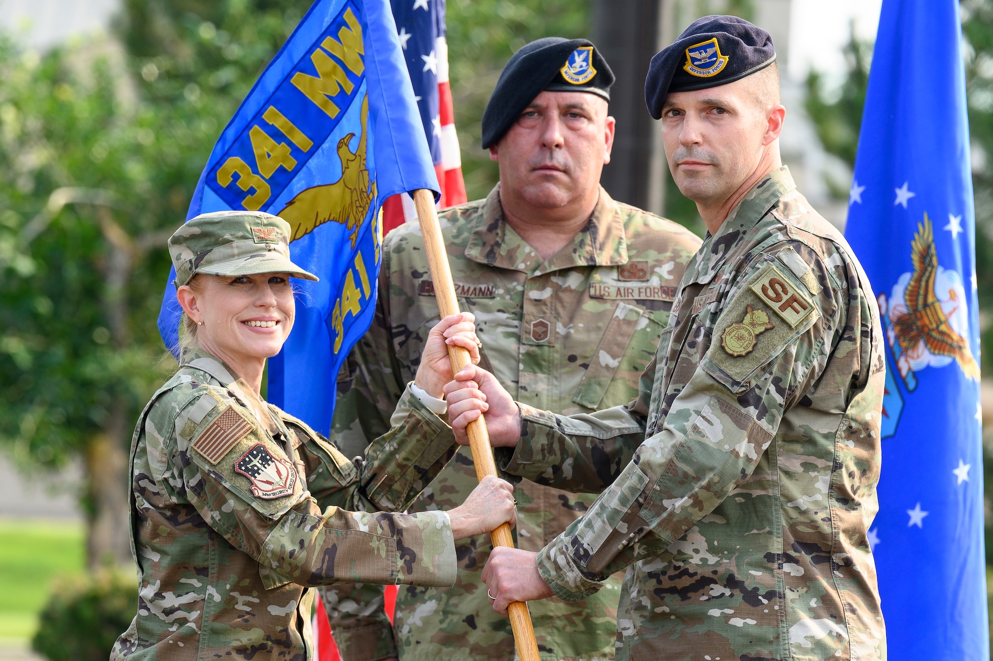 Col. Steven Bauman, right, accepts command of the 341st Security Forces Group from Col. Anita Feugate Opperman, 341st Missile Wing commander, during a change of command ceremony July 21, 2021, at Malmstrom Air Force Base, Mont.
