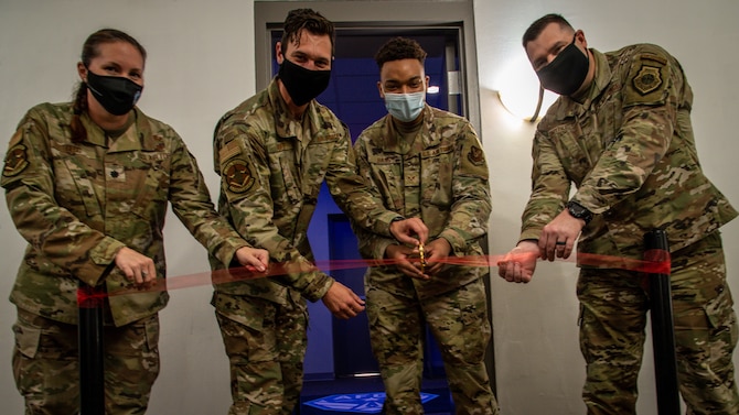 Base leadership joins Barksdale Airmen in cutting the ribbon to the new e-gaming room at Barksdale Air Force Base, Louisiana, July 20, 2021.