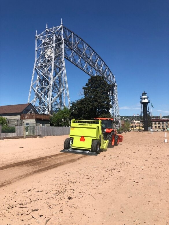 U.S Army Corps of Engineers, Duluth Area Office uses a mechanical beach rake from the Aerial Lift Bridge to 36th Street to clean debris placed during 2020 beach nourishment on Minnesota Point.