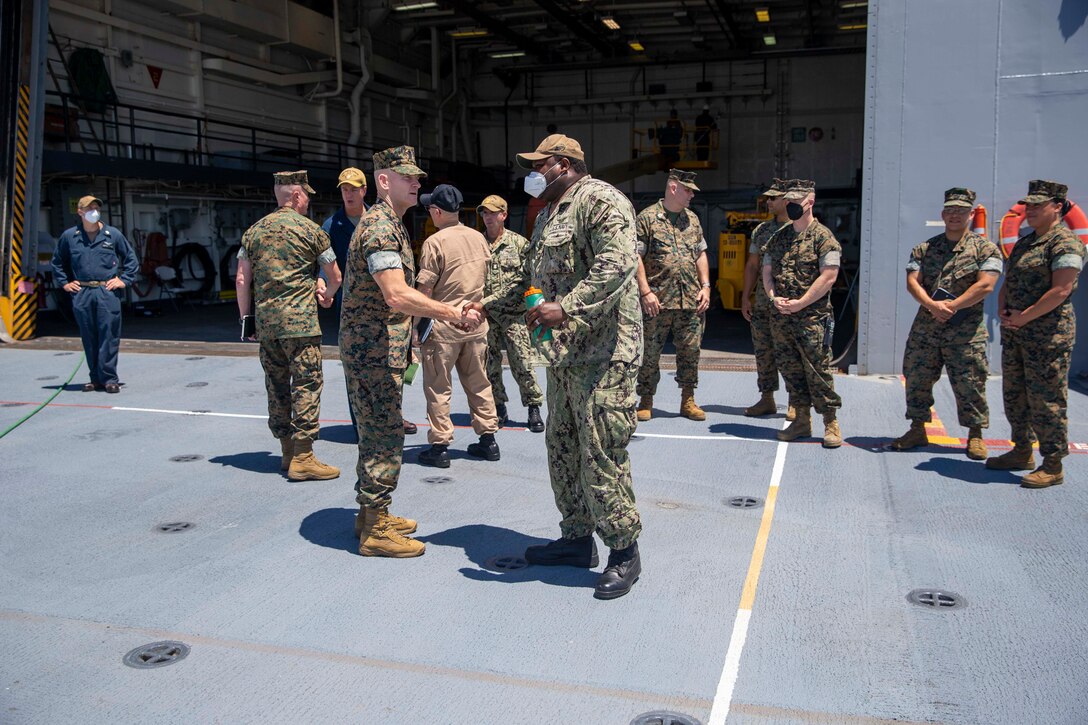 The 19th Sergeant Major of the Marine Corps, Sgt. Maj. Troy E. Black, tours the USS Mesa Verde, Norfolk, Va, July 14, 2021. The Sergeant Major of the Marine Corps received a tour of the ship from the Marine ship team. The Marine ship team builds integration between the Marine Corps and the Navy to facilitate operations while underway. (U.S. Marine Corps photo by Sgt. Victoria Ross)