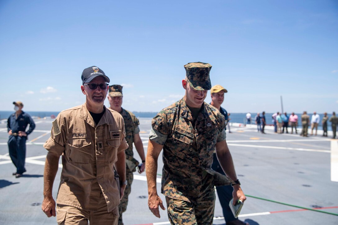 The 19th Sergeant Major of the Marine Corps, Sgt. Maj. Troy E. Black, tours the USS Mesa Verde, Norfolk, Va, July 14, 2021. The Sergeant Major of the Marine Corps received a tour of the ship from the Marine ship team. The Marine ship team builds integration between the Marine Corps and the Navy to facilitate operations while underway. (U.S. Marine Corps photo by Sgt. Victoria Ross)