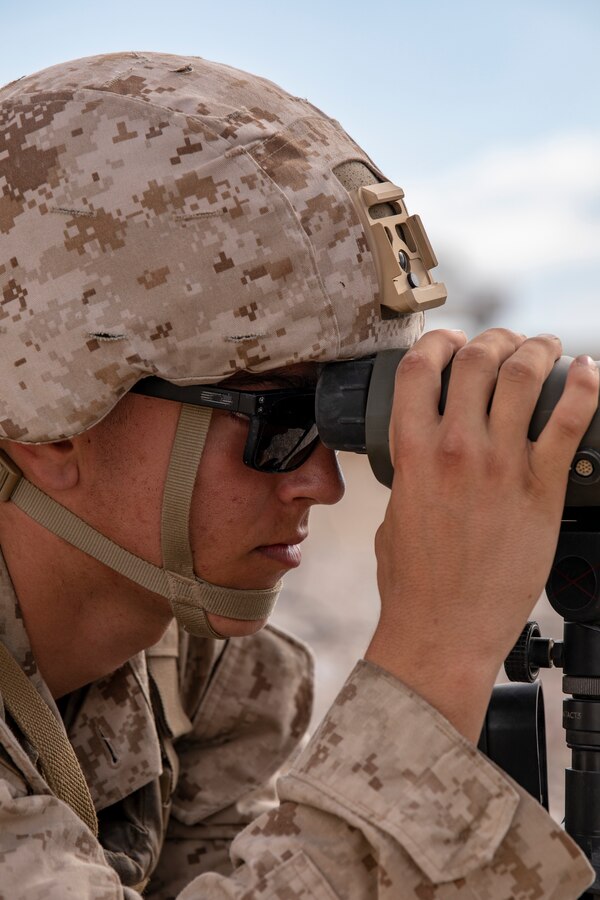 Lance Cpl. Reece Ackerman, a forward air observer with 3rd Battalion, 25th Marines scans for targets during Fire Support Coordination Exercise (FSCEX) 1, a sub-event of Integrated Training Exercise (ITX) 4-21 at Marine Corps Air Ground Combat Center, Twentynine Palms, California on July 22, 2021. FSCEX allows Reserve Marines to coordinate various fires assets from across Marine Air Ground Task Force 25 to eliminate enemy positions in a simulated combat environment. (U.S. Marine Corps photo by Sgt. JVonnta Taylor)
