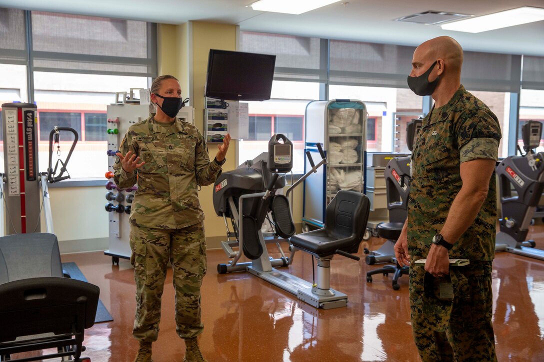 The 19th Sergeant Major of the Marine Corps, Sgt. Maj. Troy E. Black, tours the Brooke Army Medical Center, San Antonio, Texas, July 20, 2021. The Sergeant Major of the Marine Corps conducted the tour to get an update on the research and recovery facilities that support Wounded Warrior Battalion-East, San Antonio detachment. Wounded Warrior Battalion supports recovery, and non-medical care of combat and non-combat wounded, ill, and injured Marines, and sailors attached to Marine units, and their family members in order to maximize their recovery as they return to duty or transition to civilian life. (U.S. Marine Corps photo by Sgt. Victoria Ross)