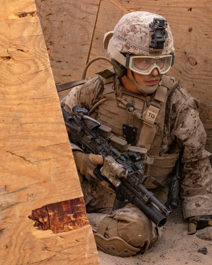 A U.S. Marine with India Company, 3rd Battalion, 25th Marines, 4th Marine Division, prepares to attack an enemy position on Range 410A during Integrated Training Exercise (ITX) 4-21 at Marine Corps Air Ground Combat Center, Twentynine Palms, California on July 22. Range 410A provides Reserve Marines the opportunity to execute a fire and maneuver attack supported by mortarmen, machine gunners and combat engineers. (U.S. Marine Corps photo by Sgt. JVonnta Taylor)