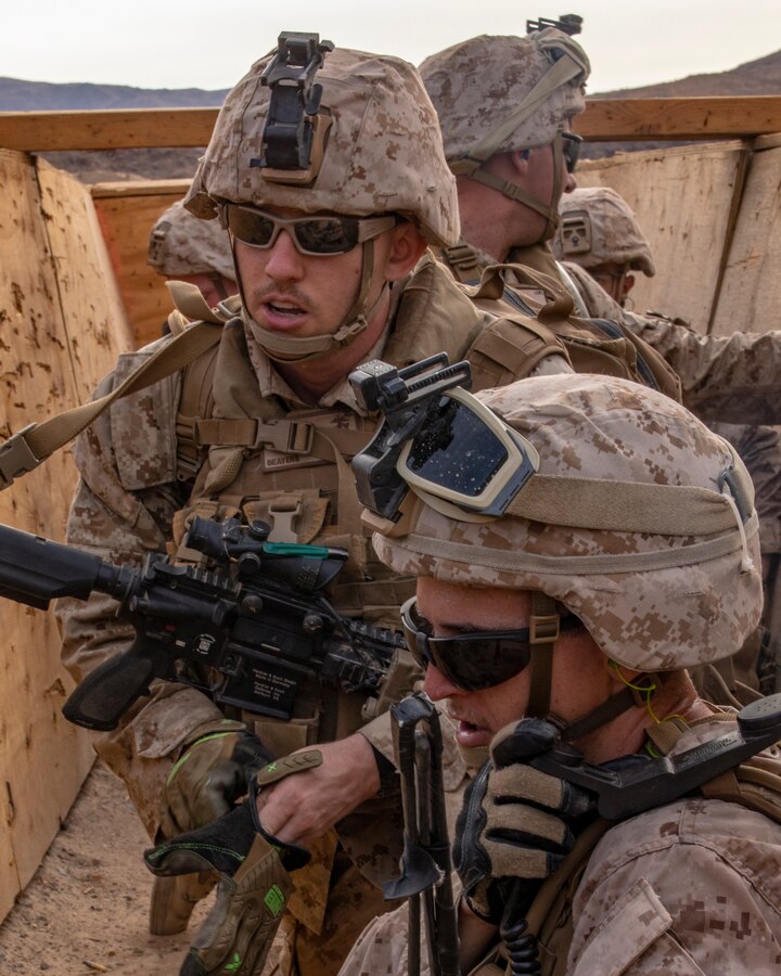 Marines with India Company, 3rd Battalion, 25th Marines, 4th Marine Division, relay enemy positions on Range 410A during Integrated Training Exercise (ITX) 4-21 at Marine Corps Air Ground Combat Center, Twentynine Palms, California on July 22. Range 410A provides Reserve Marines the opportunity to execute a fire and maneuver attack supported by mortarmen, machine gunners and combat engineers. (U.S. Marine Corps photo by Sgt. JVonnta Taylor)