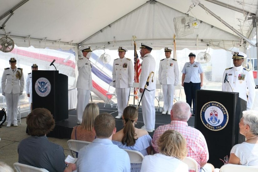 Capt. Timothy P. Cronin, right, transferred command of the United States Coast Guard Cutter Hamilton (WMSL 753) to Capt. Matthew T. Brown, left, during a change of command ceremony held at U.S. Coast Guard Base Charleston, S.C., July 23, 2021. Vice Adm. Steven D. Poulin presided over the event. (U.S. Navy photo by Mass Communication Specialist 1st Class Brian M. Wilbur)