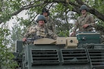 HIMARS crew members in the 1-147th Field Artillery Battalion, South Dakota National Guard, conduct annual training, waiting for orders inside their M270A1 MLRS at Camp Ripley Training Center in Minnesota July 15, 2021. The main mission of the 1-147th FA is to deliver precision fire on enemies.