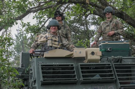 HIMARS crew members in the 1-147th Field Artillery Battalion, South Dakota National Guard, conduct annual training, waiting for orders inside their M270A1 MLRS at Camp Ripley Training Center in Minnesota July 15, 2021. The main mission of the 1-147th FA is to deliver precision fire on enemies.