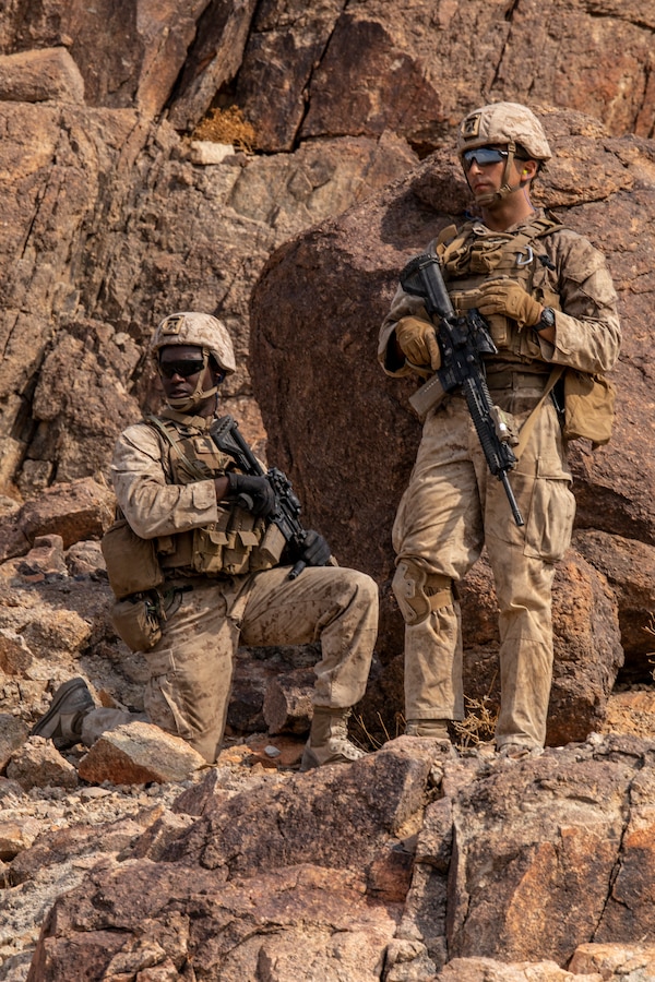 Marines with Kilo Company, 3rd Battalion, 25th Marines, 4th Marine Division, standby for advancement orders on Range 400 during Integrated Training Exercise (ITX) 4-21 at Marine Corps Air Ground Combat Center, Twentynine Palms, California on July 23, 2021. Range 400 is a company-sized live-fire assault range that requires complex coordination of fires, producing combat-ready Reserve Marines prepared to augment and reinforce the Active Component. (U.S. Marine Corps photo by Sgt. JVonnta Taylor)