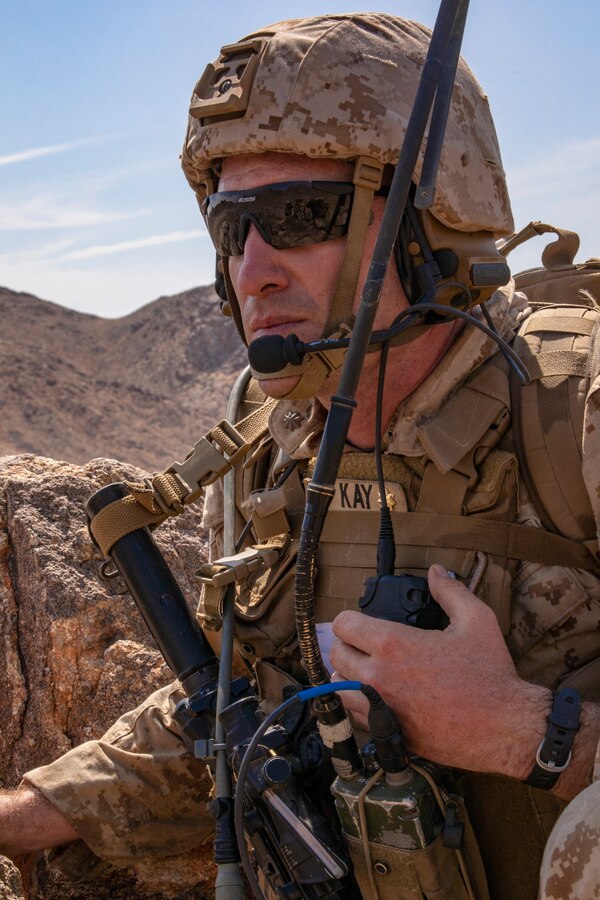 A Marine with Kilo Company, 3rd Battalion, 25th Marines, 4th Marine Division, prepares to call for fire on Range 400 during Integrated Training Exercise (ITX) 4-21 at Marine Corps Air Ground Combat Center, Twentynine Palms, California on July 23, 2021. Range 400 is a company-sized live-fire assault range that requires complex coordination of fires, producing combat-ready Reserve Marines prepared to augment and reinforce the Active Component. (U.S. Marine Corps photo by Sgt. JVonnta Taylor)