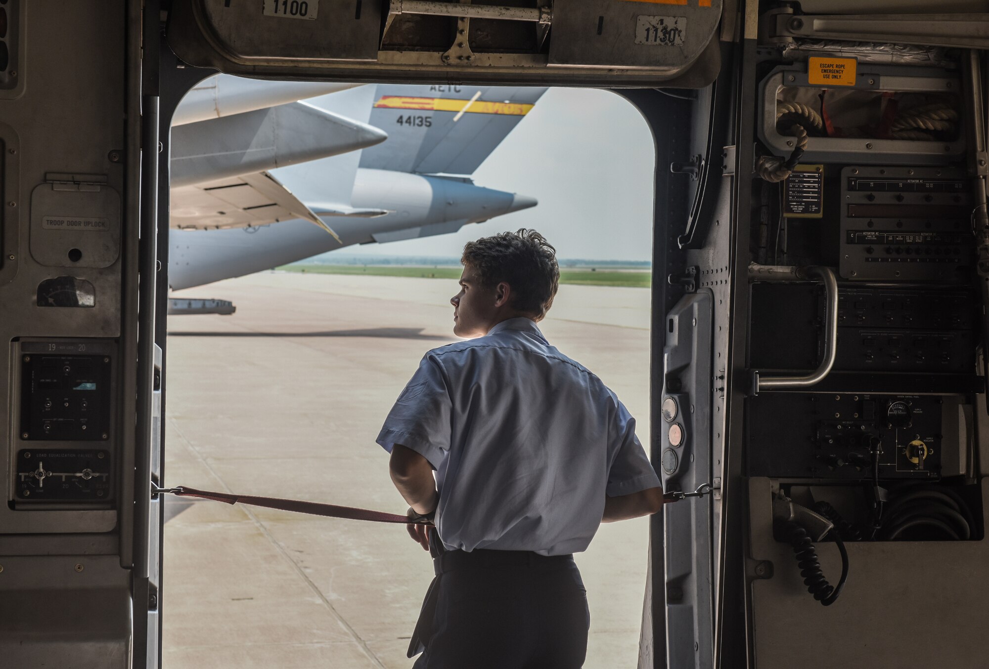 Boy looks out of aircraft