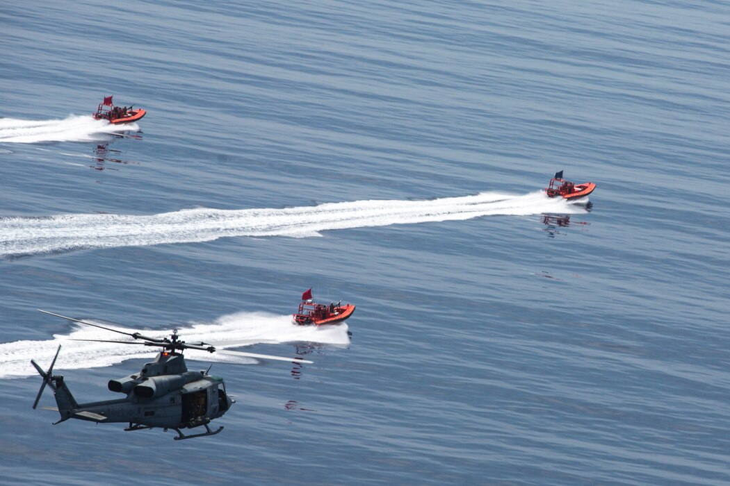 A U.S. Marine Corps UH-1Y Venom with Marine Light Attack Helicopter Squadron 469, Marine Aircraft Group 39, 3rd Marine Aircraft Wing (MAW), perform offensive aerial maneuvers during the Advanced Naval Basing evolution of Summer Fury 21 off the coast of San Clemente Island, California, July 22, 2021. 3rd MAW trained to increase its lethality by deploying buoyant targets simulating enemy small vessels to be tracked and eliminated. Summer Fury is an exercise conducted by 3rd MAW in order to maintain and build capability, strength, and trust within its units to generate the readiness and lethality needed to deter and defeat adversaries during combat operations as the U.S. Marine Corps refines tactics and equipment in accordance with Force Design 2030. (U.S. Marine Corps photo by Cpl. Levi Voss)