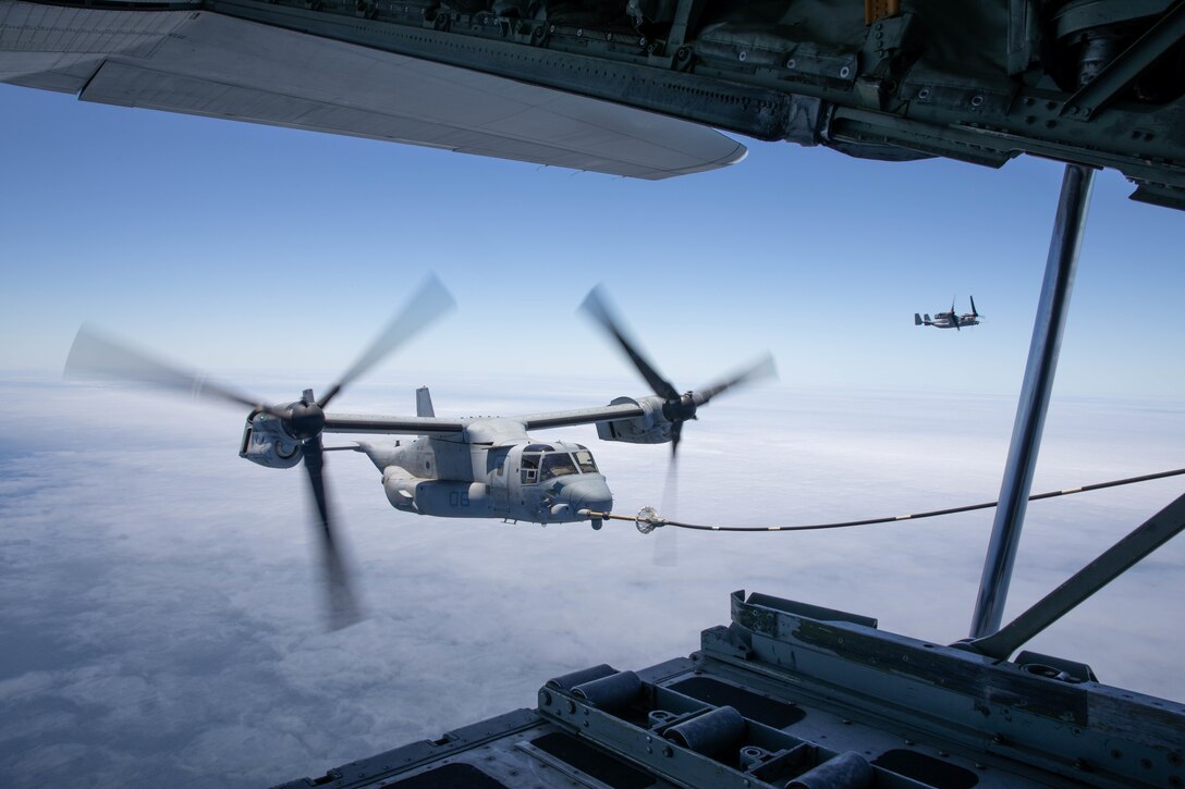 U.S. Marine Corps MV-22B Osprey's with Marine Aircraft Group 16, 3rd Marine Aircraft Wing (MAW), conduct air to air refueling operations during Marine Corps training exercise Summer Fury 21 at Marine Corps Air Station Miramar, California, July 7, 2021. The importance of aerial refueling is to extend the range of an aircraft’s ability to remain in the air and combat effective during maritime operations, especially in coastal regions, which will be contested and dangerous, compelling the Marine Corps to operate in an increasingly dispersed manner. Summer Fury is an exercise conducted by 3rd MAW in order to maintain and build capability, strength and trust within its units to generate the readiness and lethality needed to deter and defeat adversaries during combat operations as the U.S. Marine Corps refines tactics and equipment in accordance with Force Design 2030. (U.S. Marine Corps photo by Lance Cpl. Quince Bisard)