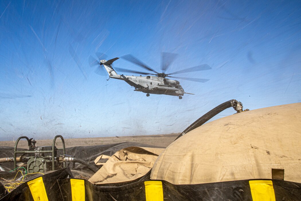 A CH-53E Super Stallion with 3rd Marine Aircraft Wing (MAW), departs a forward arming and refueling point (FARP) that has been established on San Clemente Island, July 20, 2021. During Advanced Naval Basing evolution of Summer Fury 21, 3rd MAW established a FARP on the existing airfield to increase the range and tempo of aviation operations within the area of responsibility to evaluate the operational capability for application in future conflicts. Summer Fury is an exercise conducted by 3rd MAW in order to maintain and build capability, strength and trust within its units to generate the readiness and lethality needed to deter and defeat adversaries during combat operations as the U.S. Marine Corps refines tactics and equipment in accordance with Force Design 2030. (U.S. Marine Corps photo by Lance Cpl. Quince Bisard)