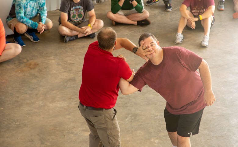 Adam Tarplee (left) and Steve Perrin,  U.S. Army Corps of Engineers (USACE) Park Rangers with the Fort Worth District, demonstrate self-defense techniques as part of USACE Galveston District's Ranger Appreciation and Refresher Training event, July 14. Policy requires all USACE Rangers to receive eight hours of training annually on a variety of topics such as self-defense, tactical communications, policy, changes in policy, and cultural demographics.