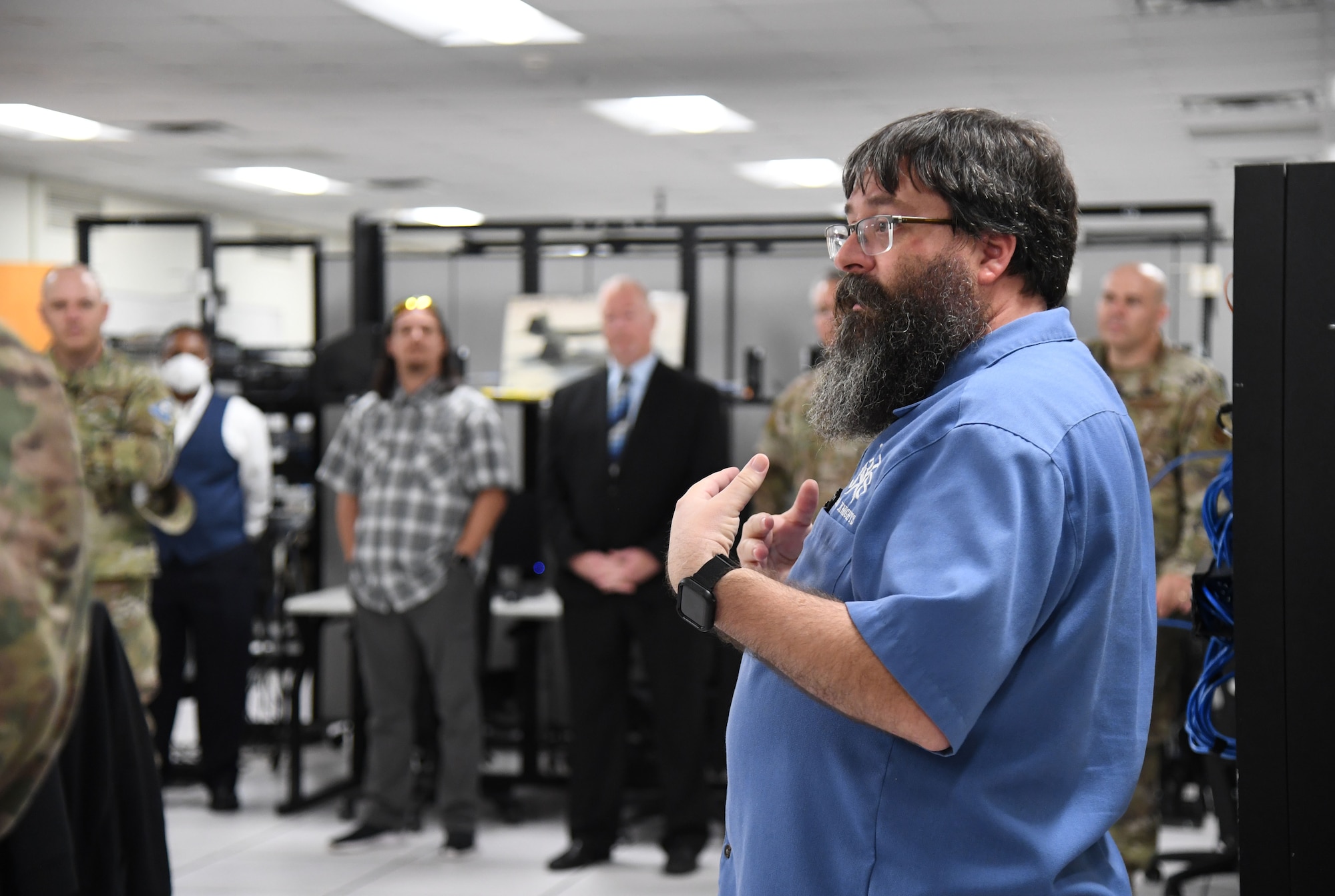Bill Collum, 338th Training Squadron training manager, provides a tour and briefing on 338th TRS courses inside Bryan Hall at Keesler Air Force Base, Mississippi, July 21, 2021. The 81st Training Support Squadron hosted the Cyber Operations Specialty Training and Requirements Team Conference for cyber operations career field managers and MAJCOM functional managers July 19-23. (U.S. Air Force photo by Kemberly Groue)