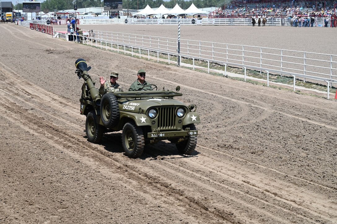 Maj. Gen. Michael Lutton, 20th Air Force commander, enters Frontier Park during the grand entrance to Military Monday at Frontier Park in Cheyenne, Wyoming, July 26, 2021. Military Monday honors those serving in the local community and provides an opportunity to showcase the strong relationship between the base and the local community.