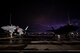 Two F-35 Lightning IIs sit on the flight line during thunderstorm,