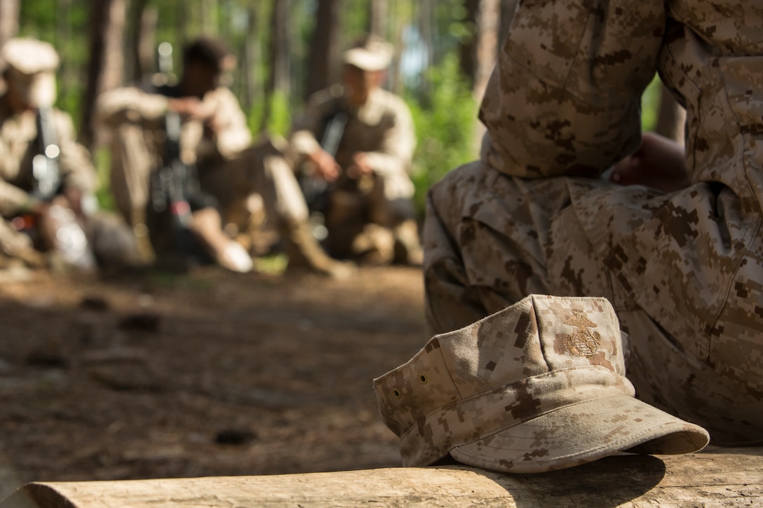 U.S. Marine Corps Staff Sgt. Jade Nichols, a senior drill instructor with Papa Company, 4th Recruit Training Battalion, discusses reasons for joining the Marine Corps with her recruits during the Crucible at Parris Island, S.C. April 20, 2018. The four phase recruit training model, implemented in November 2017, allows the drill instructors the opportunity to transition to a role of coach and mentor.