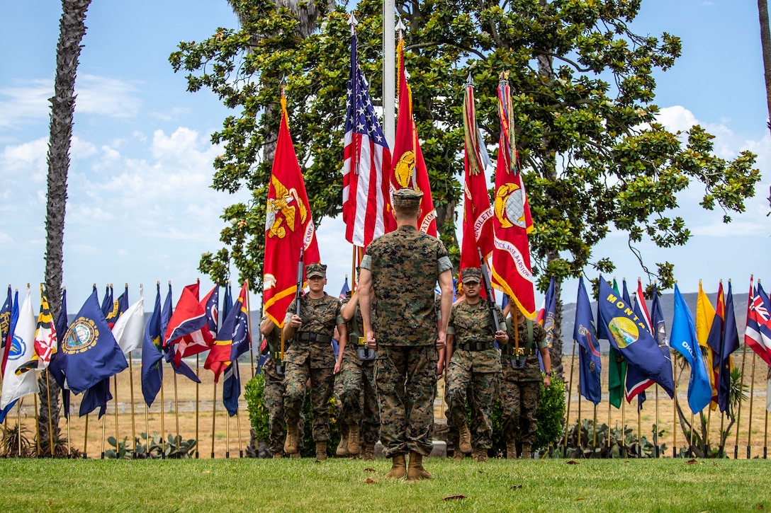 U.S. Marines with Headquarters and Support Battalion, Marine Corps Base Camp Pendleton, march on the colors during a change of command ceremony for Marine Corps Installations West, MCB Camp Pendleton, at the Santa Margarita Ranch House on Camp Pendleton, Calif., June 23, 2021. During the ceremony, U.S. Marine Brig. Gen. Dan Conley relinquished command of MCI-West to Brig. Gen. Jason Woodworth. Woodworth is the first Marine in history to command an MCI-West installation and then return to take command of the region.